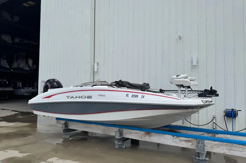 Slide: The Image of 2022 Tahoe 1950 boat on a stand outside a storage facility. - 24