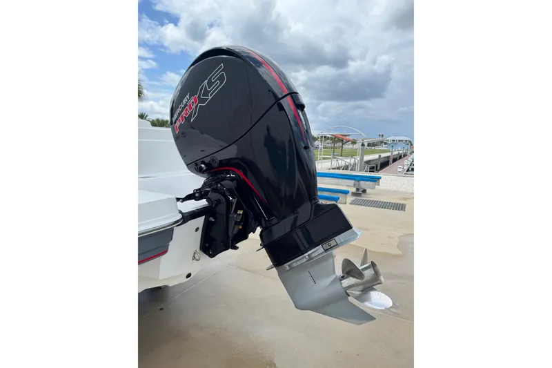Slide: The Image of Outboard motor on a 2022 Tahoe 1950 boat, dockside view. - 29