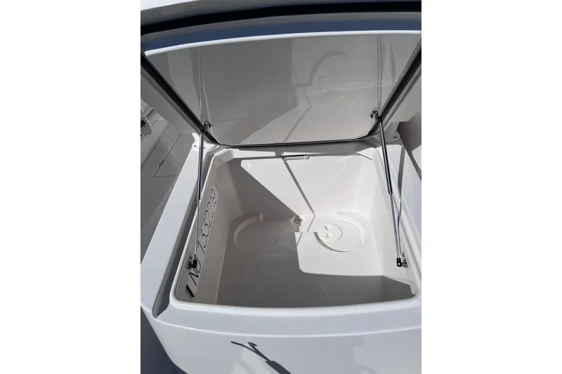 Slide: The Image of Open storage compartment on a 2021 Jupiter 34 boat, showcasing spacious interior. - 12