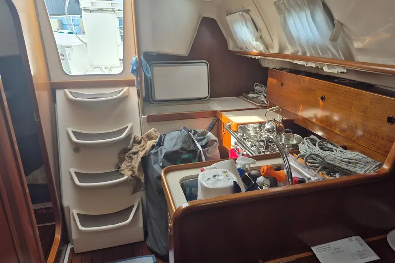 Slide: The Image of Interior of 1997 Beneteau Oceanis 321 sailboat with kitchen and storage area. - 20