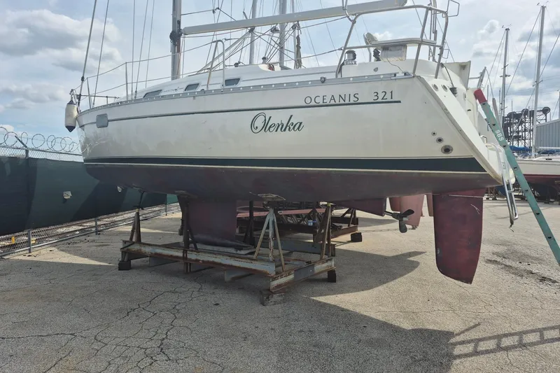 Slide: The Image of 1997 Beneteau Oceanis 321 sailboat on dry dock, ready for maintenance. - 27