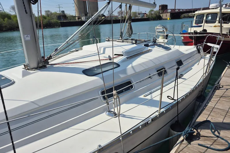 Slide: The Image of 1997 Beneteau Oceanis 321 sailboat docked in a marina, sunny day. - 5