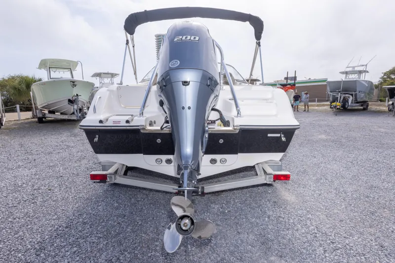 Slide: The Image of 2022 Key West 203 DFS boat with outboard motor on trailer, rear view. - 14