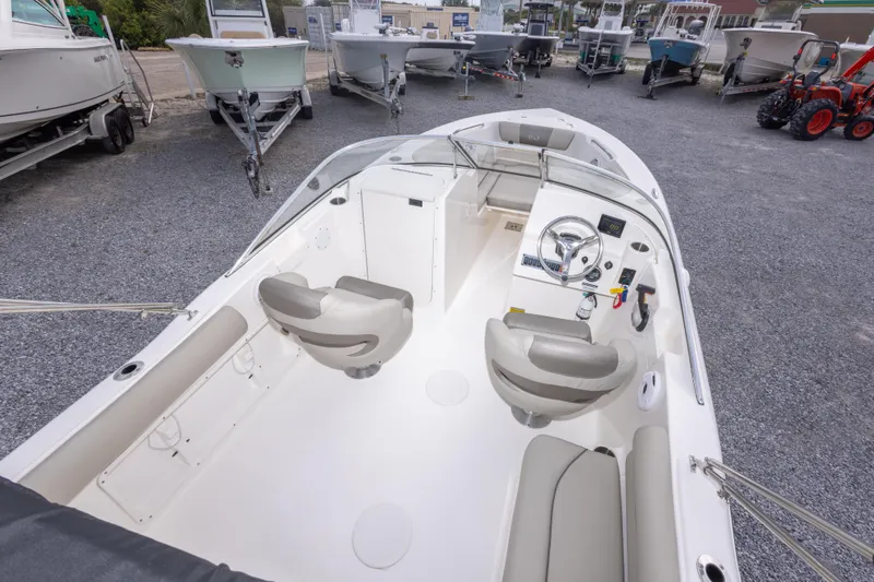 Slide: The Image of 2022 Key West 203 DFS boat interior with dual seats and steering console. - 21