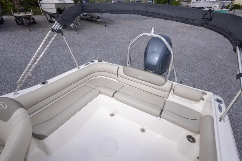 Slide: The Image of 2022 Key West 203 DFS boat interior with seating and outboard motor. - 22
