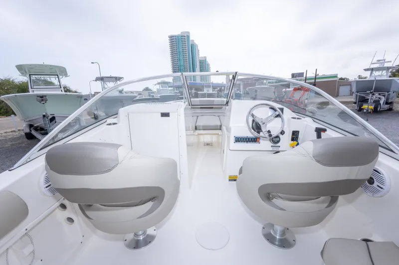 Slide: The Image of 2022 Key West 203 DFS boat interior with dual seats and control panel. - 33