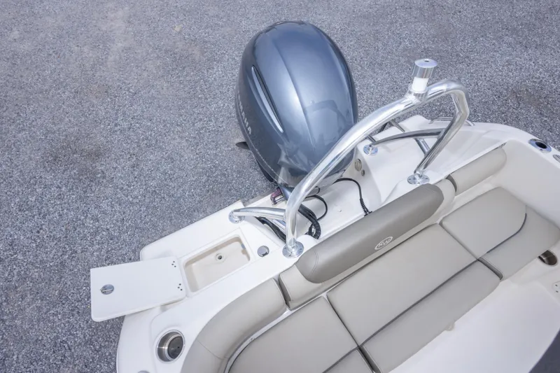 Slide: The Image of 2022 Key West 203 DFS boat with outboard motor and seating area. - 36