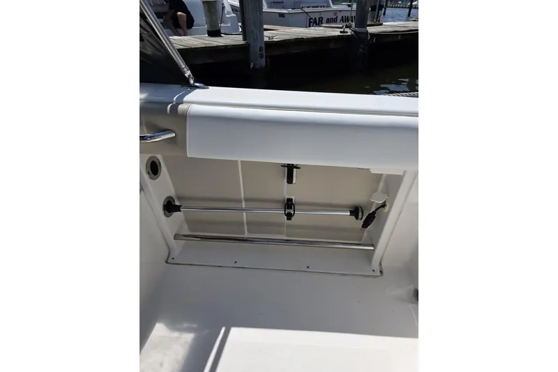 Slide: The Image of 2018 Robalo R227 Dual Console boat interior storage compartment. - 6