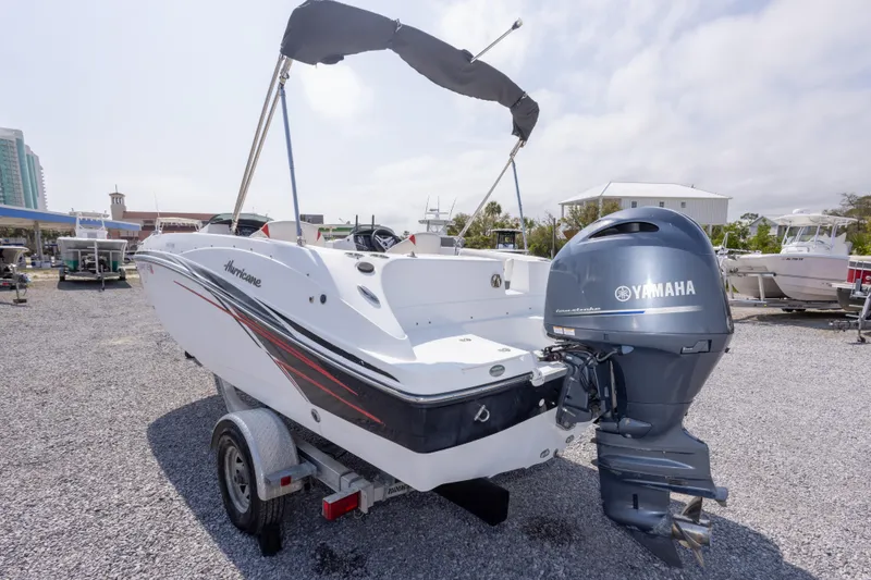 Slide: The Image of 2018 Hurricane SunDeck Sport 192 OB boat with Yamaha outboard motor on trailer. - 10