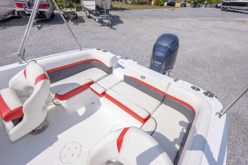 Slide: The Image of 2018 Hurricane SunDeck Sport 192 OB boat interior with red and white seating. - 17