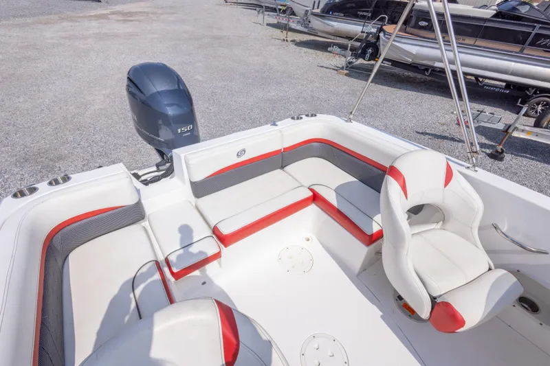 Slide: The Image of 2018 Hurricane SunDeck Sport 192 OB boat interior with seating and outboard motor. - 18