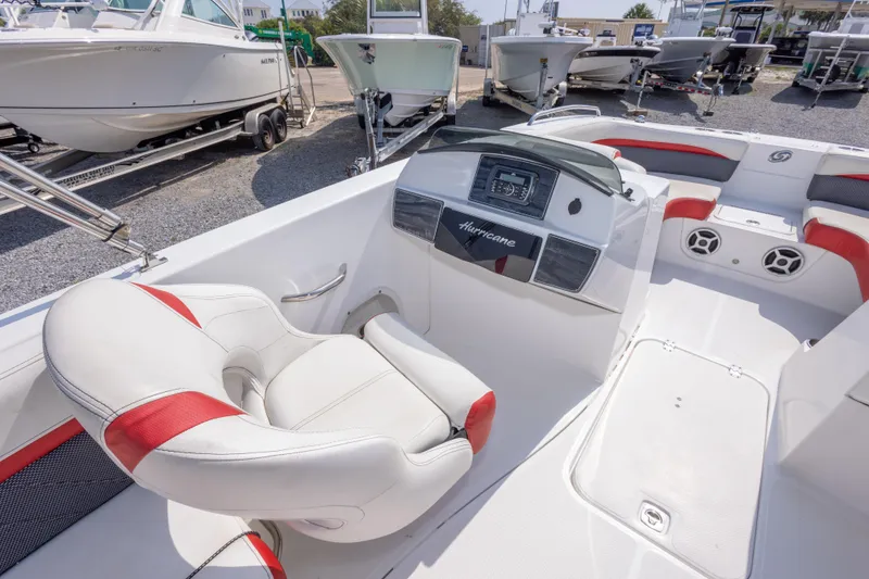 Slide: The Image of 2018 Hurricane SunDeck Sport 192 OB boat interior with white and red seating. - 19