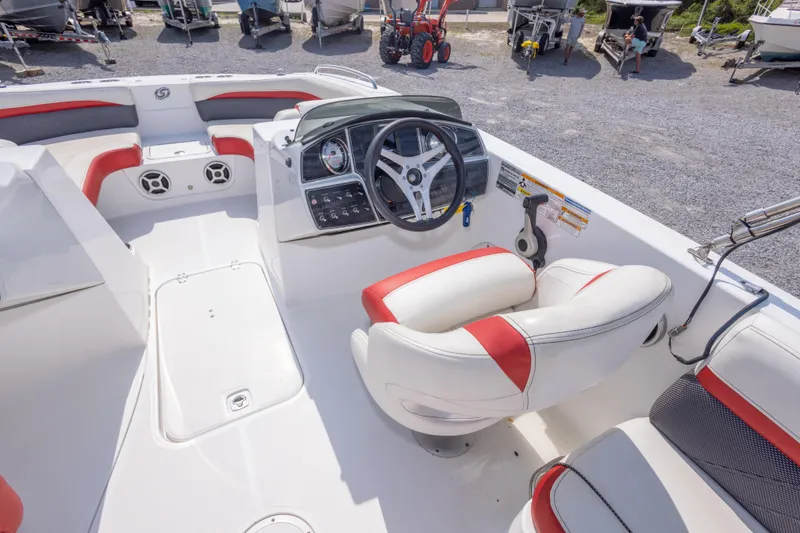 Slide: The Image of 2018 Hurricane SunDeck Sport 192 OB boat interior with steering wheel and seating. - 20