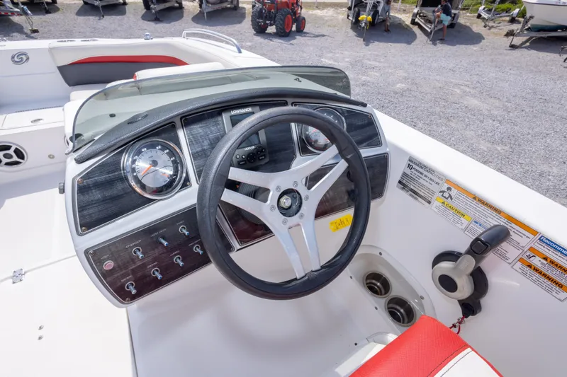 Slide: The Image of 2018 Hurricane SunDeck Sport 192 OB boat dashboard with steering wheel and controls. - 23