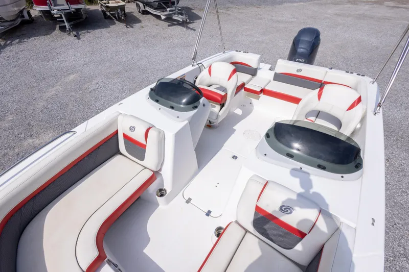 Slide: The Image of 2018 Hurricane SunDeck Sport 192 OB boat interior with red and white seating. - 26