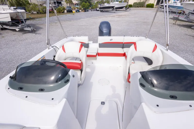 Slide: The Image of 2018 Hurricane SunDeck Sport 192 OB boat interior with red and white seating. - 27