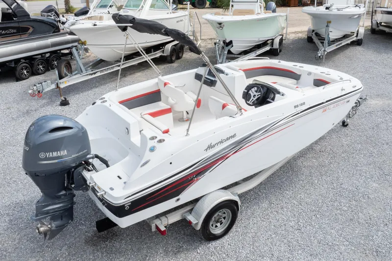 Slide: The Image of 2018 Hurricane SunDeck Sport 192 OB boat with Yamaha engine on trailer. - 29