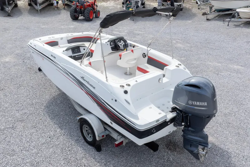 Slide: The Image of 2018 Hurricane SunDeck Sport 192 OB boat with Yamaha outboard motor on trailer. - 32