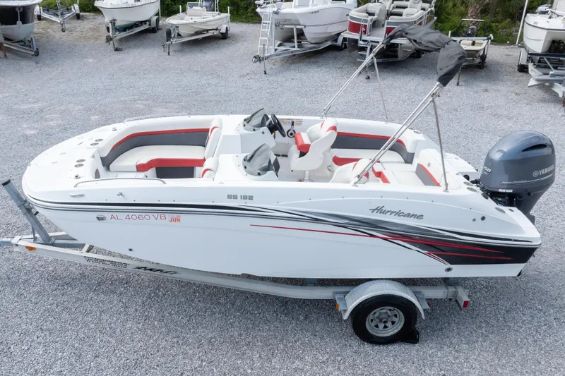 Slide: The Image of 2018 Hurricane SunDeck Sport 192 OB boat on trailer, featuring Yamaha outboard motor. - 33