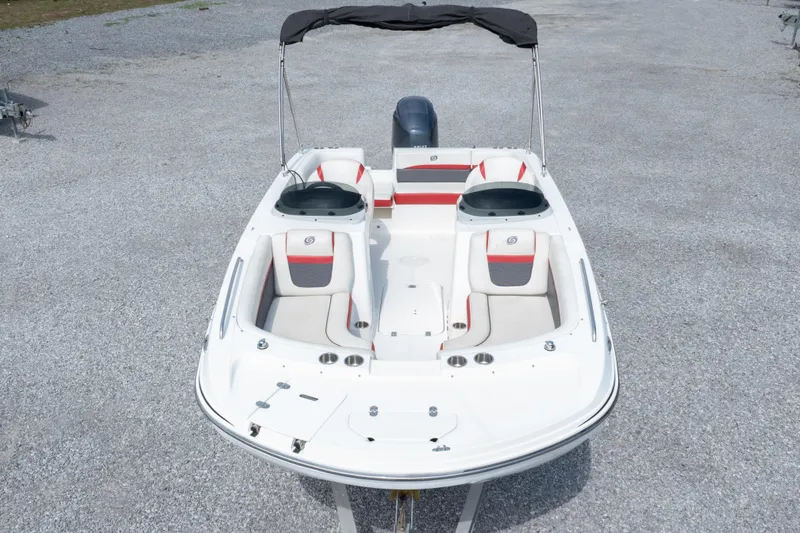 Slide: The Image of 2018 Hurricane SunDeck Sport 192 OB boat with seating, bimini top, and outboard motor. - 34