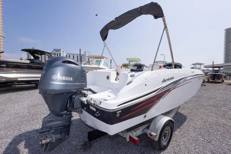 Slide: The Image of 2018 Hurricane SunDeck Sport 192 OB boat with Yamaha outboard motor on trailer. - 8