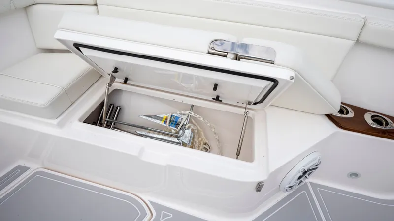 Slide: The Image of Everglades 395 Center Console 2022 anchor compartment with open lid. - 10