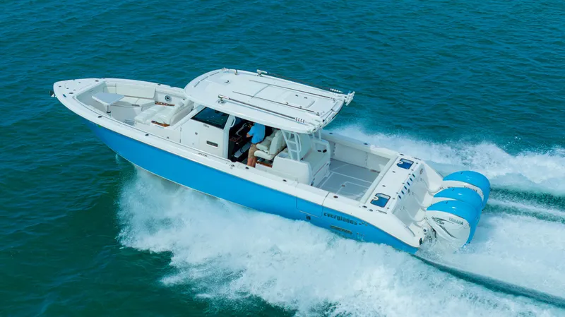 Slide: The Image of Everglades 395 Center Console 2022 cruising on the ocean. - 12