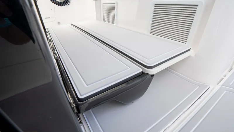 Slide: The Image of Everglades 395 Center Console 2022, foldable seating area detail. - 13