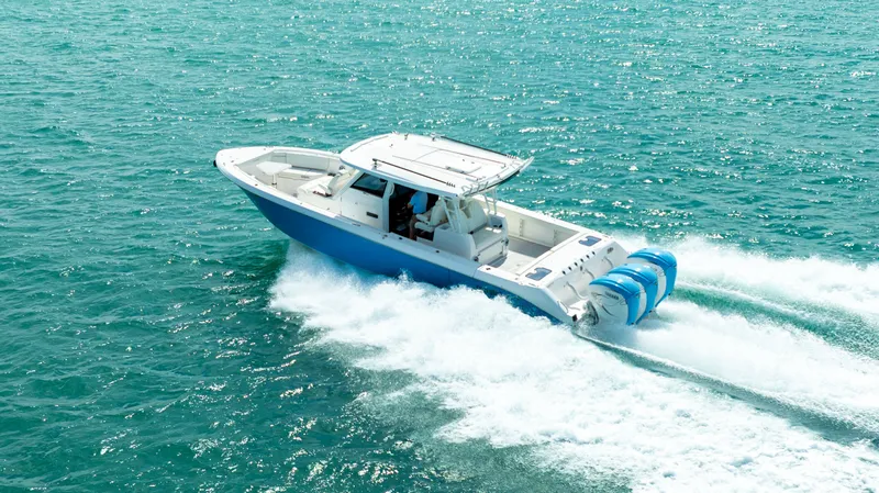 Slide: The Image of 2022 Everglades 395 Center Console cruising on open sea. - 20