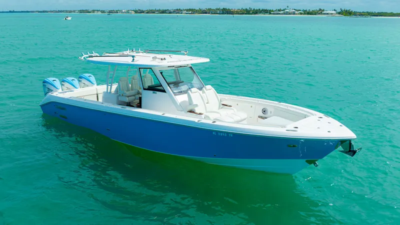 Slide: The Image of 2022 Everglades 395 Center Console on turquoise water. - 26