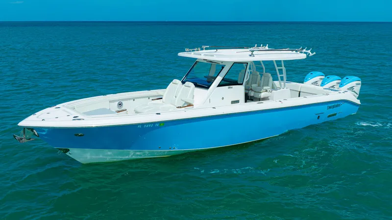 Slide: The Image of 2022 Everglades 395 Center Console boat on open sea. - 27