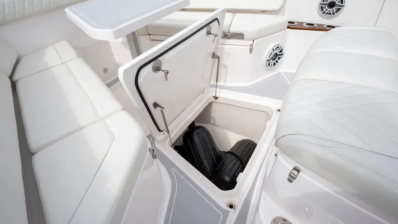 Slide: The Image of Interior of Everglades 395 Center Console 2022 with storage compartment. - 42