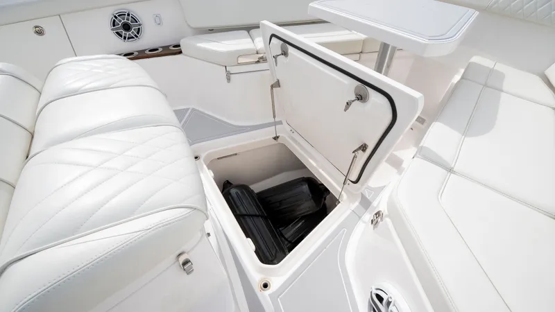 Slide: The Image of Interior of Everglades 395 Center Console 2022 with storage compartment. - 43