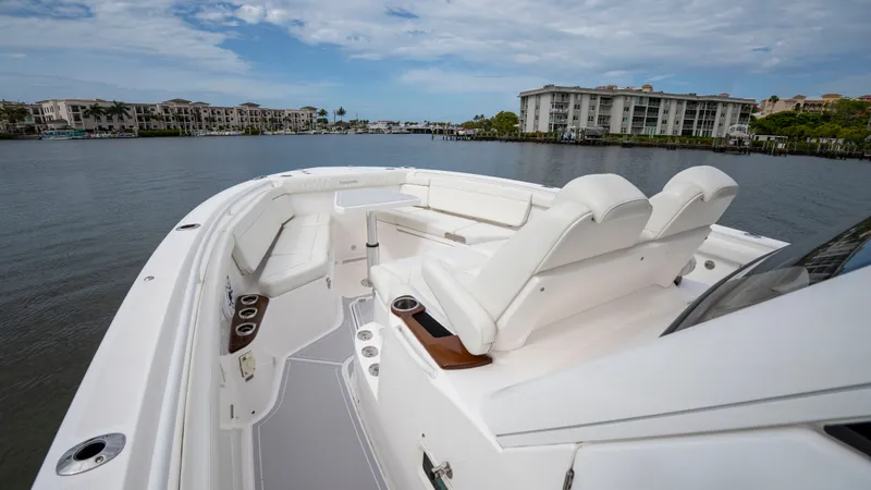 Slide: The Image of Everglades 395 Center Console 2022 on calm water near buildings. - 44