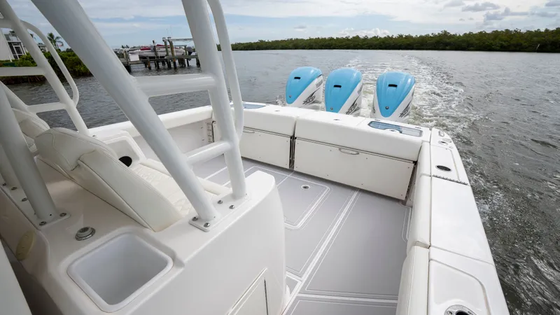 Slide: The Image of Everglades 395 Center Console 2022 on water with triple outboard engines. - 46