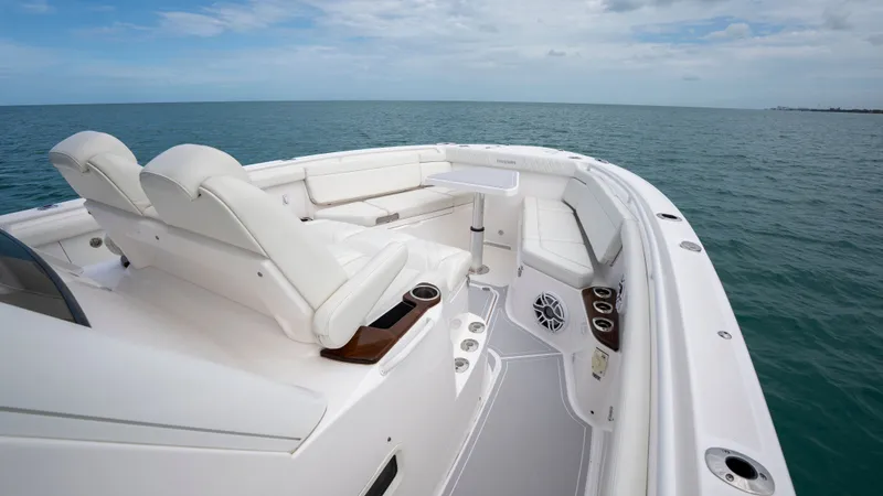 Slide: The Image of Luxurious interior of Everglades 395 Center Console 2022 on open sea. - 7