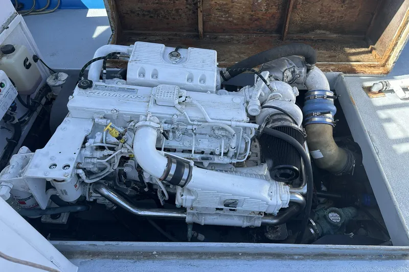 Slide: The Image of Engine compartment of a 1990 Seeway 31 boat, featuring a Cummins engine. - 13