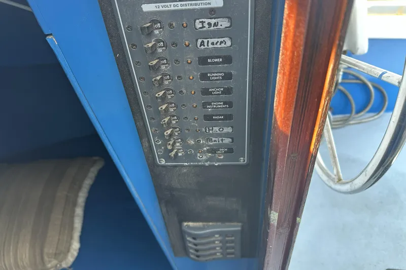 Slide: The Image of Control panel of a 1990 Seeway 31 boat with labeled switches. - 9
