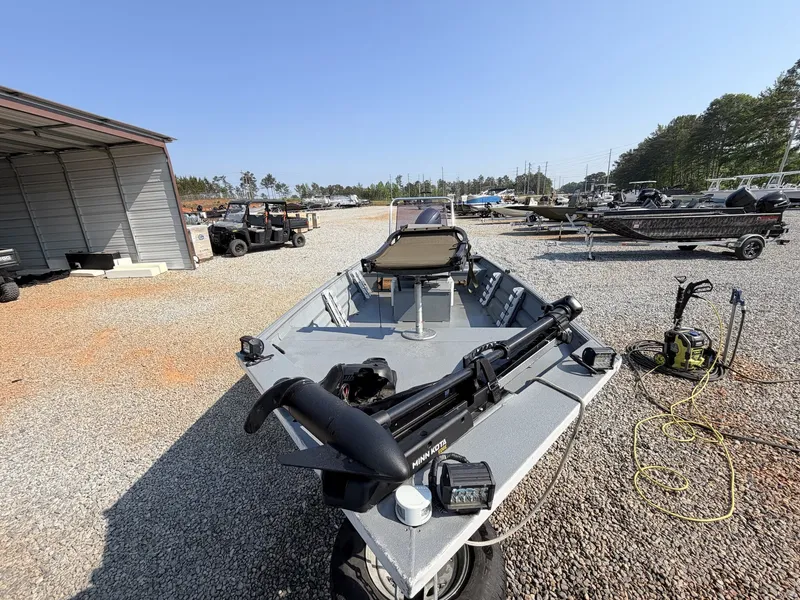 Slide: The Image of 2016 Alweld Marsh Console Series boat on gravel lot. - 6