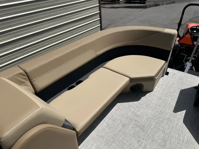 Slide: The Image of Lowe LS Walk Thru 210 2026, beige boat seating outdoors. - 9