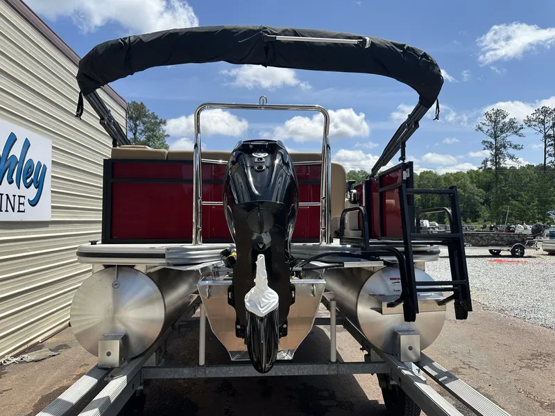 Slide: The Image of Lowe LS Walk Thru 170 pontoon boat, 2026 model, on trailer. - 3