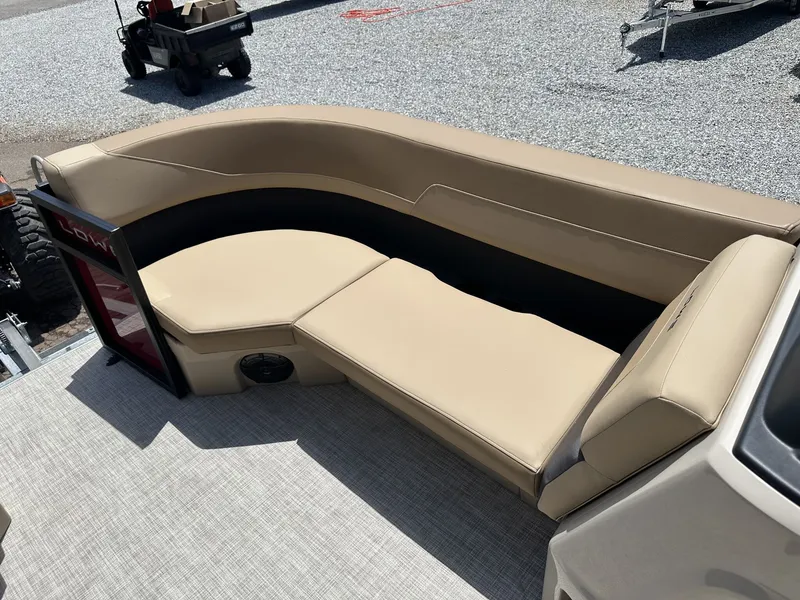 Slide: The Image of 2026 Lowe LS Walk Thru 170 boat with beige seating area. - 7