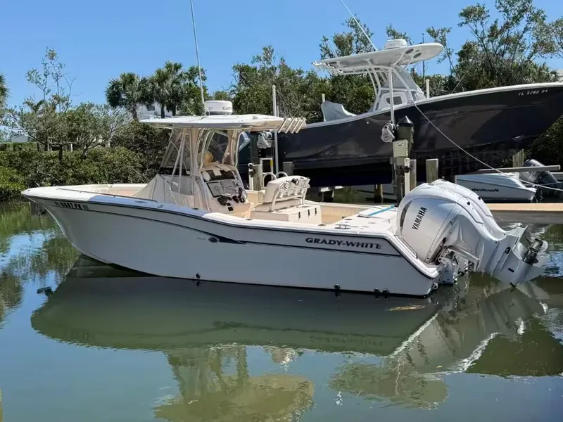 The Image of 2013 Grady-White Canyon 271 boat on water, side view. - 1