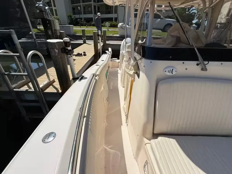 Slide: The Image of 2013 Grady-White Canyon 271 boat at dock with seating area. - 13