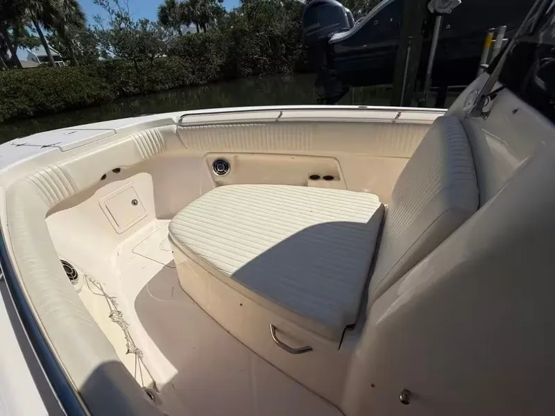 Slide: The Image of Interior of a 2013 Grady-White Canyon 271 boat with seating area. - 14