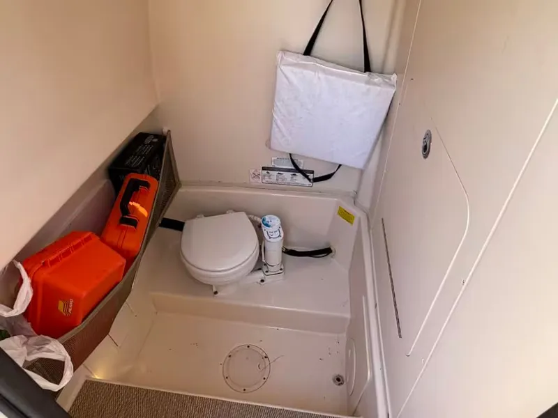 Slide: The Image of Interior of 2013 Grady-White Canyon 271 featuring a toilet. - 16