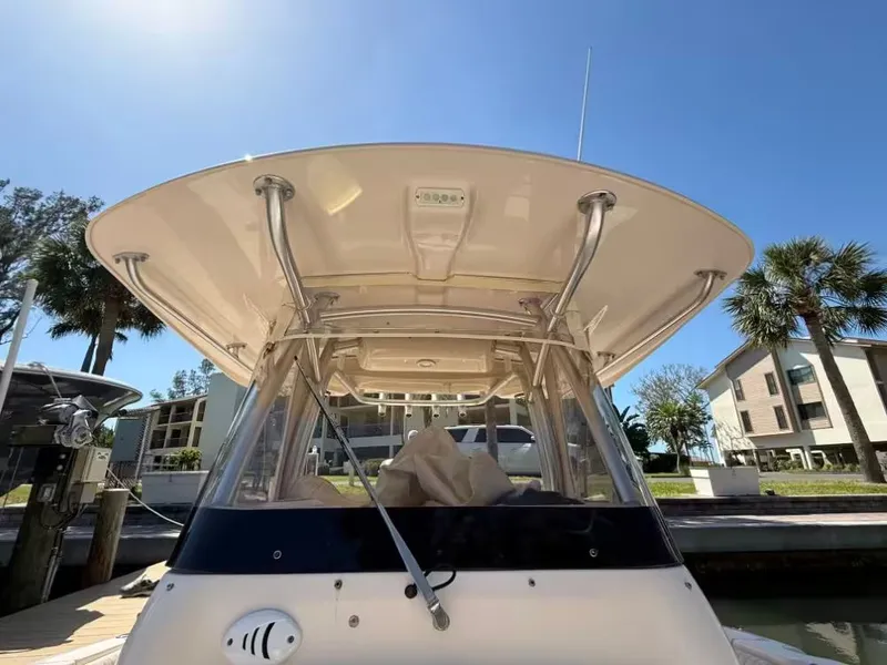 Slide: The Image of 2013 Grady-White Canyon 271 boat docked under sunny skies. - 6