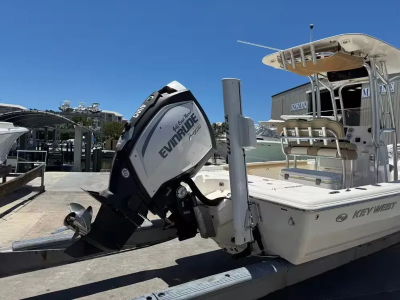 Slide: The Image of 2018 Key West 230 Bay Reef boat with Evinrude motor at dock. - 10