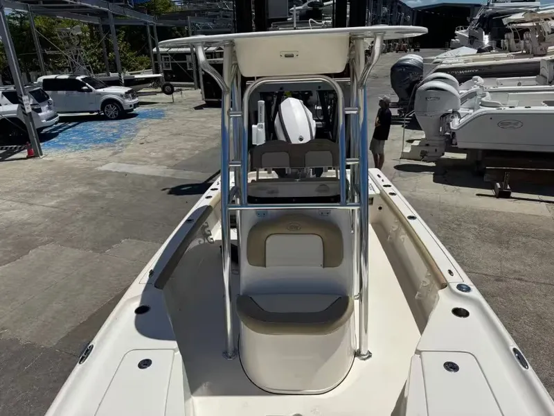 Slide: The Image of 2018 Key West 230 Bay Reef boat on a parking lot. - 12