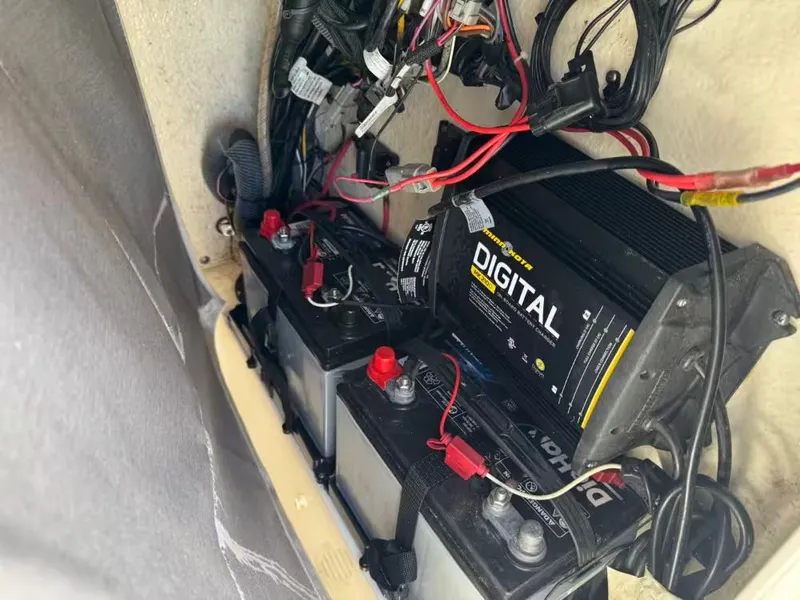 Slide: The Image of Batteries and charger in a 2018 Key West 230 Bay Reef boat. - 16